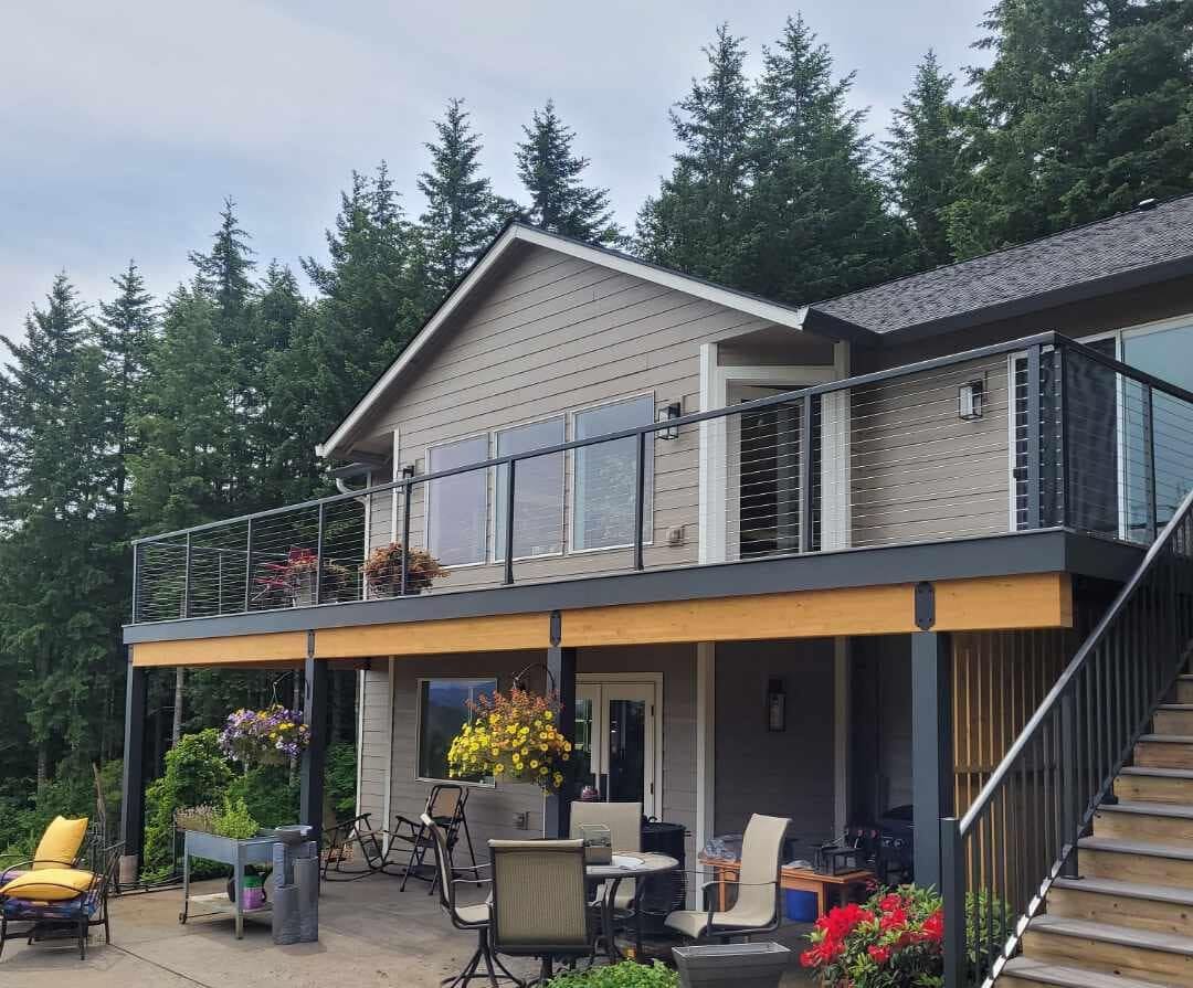 A large house with a deck and patio area.