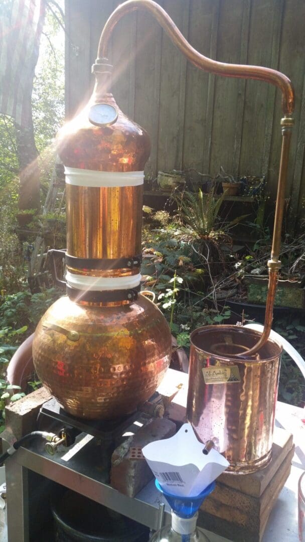 A copper pot and a large metal container