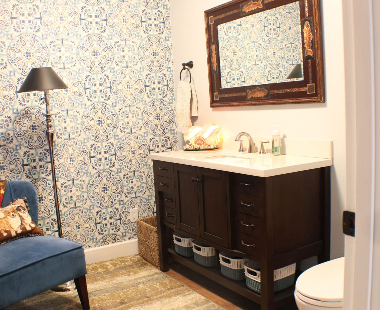 A bathroom with a toilet and sink in it