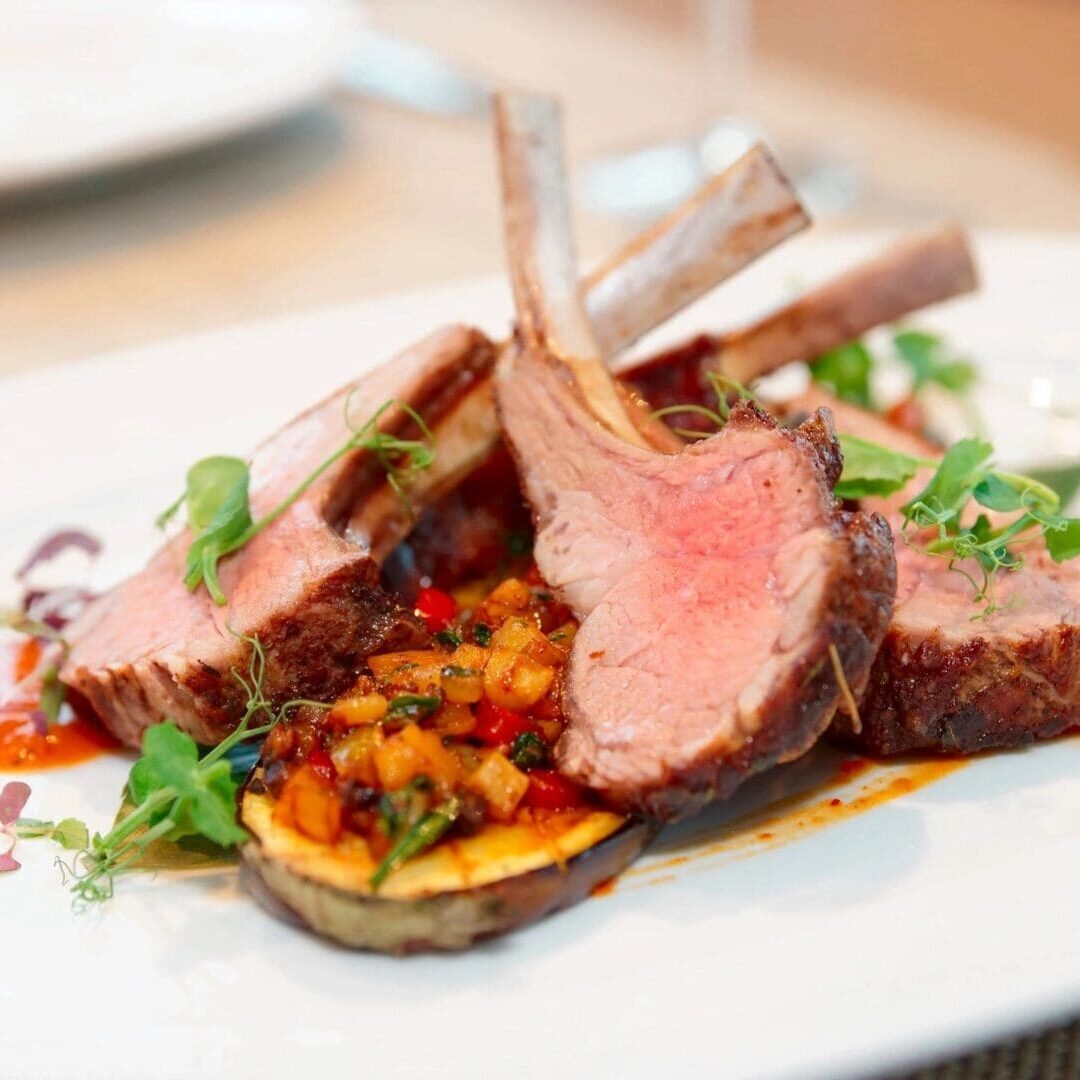 A plate of food with meat and vegetables on it.